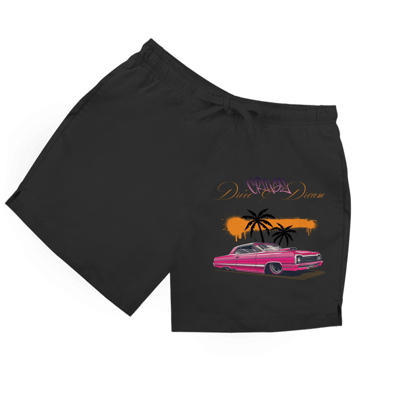 Schwarze Herren Badeshorts mit farbenfrohem Retro-Auto, Palmen und Schriftzug „Drive & Dream“.