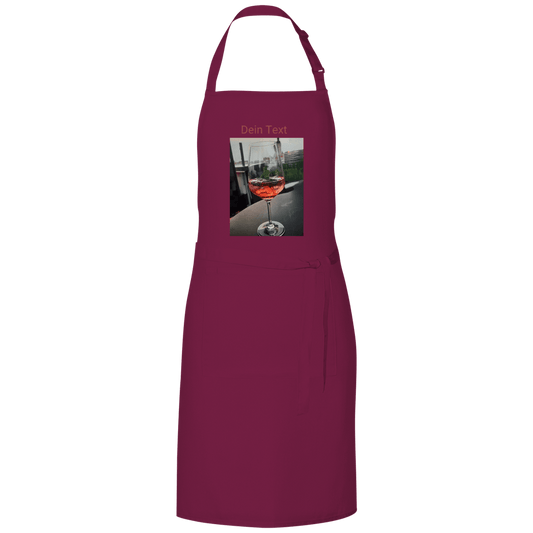 Dunkelrote Kochschürze mit indiv. Foto. Hier: Glas Aperol mit Eiswürfel. Fernweh zum Anziehen? travelPrint4U.de