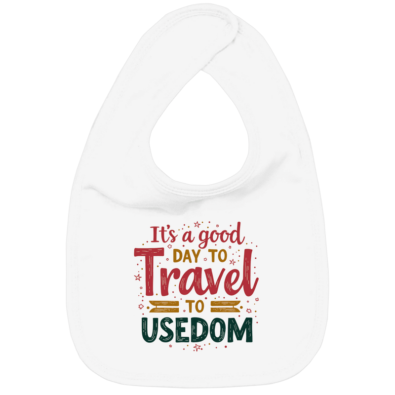 Weisses Lätzchen mit verspieltem rot, gelb und grünem Schriftzug. Ab an die Ostsee? Los geht’s für kleine Abenteurer!